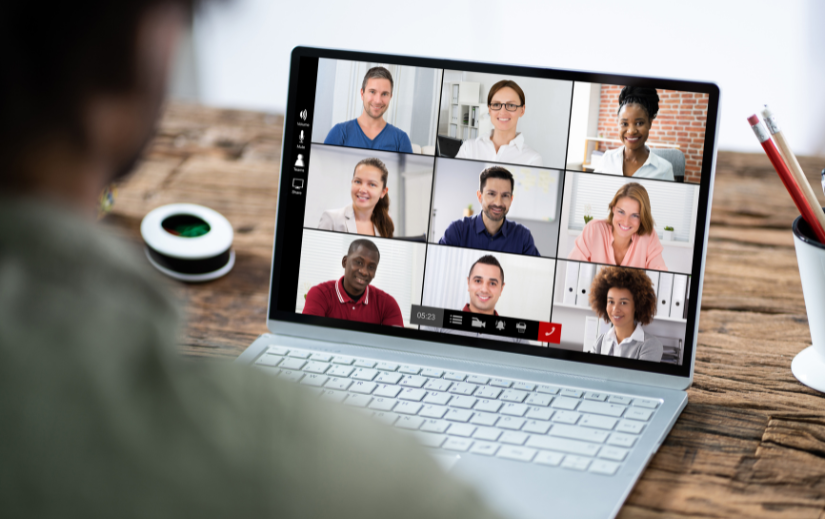 Person attending a virtual meeting on a laptop, showcasing strategies for building a brand online through collaboration.